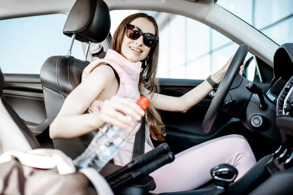 Sports woman driving a car